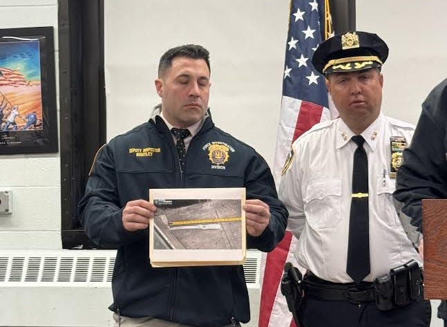 Police held up a photo of the 14-inch knife the man allegedly had when he was shot