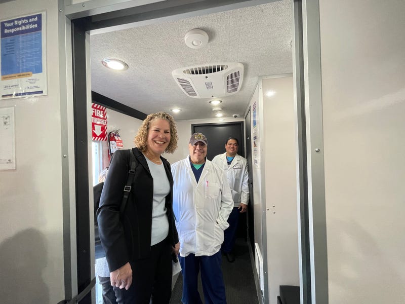 NYS OASAS Commissioner Cunningham with mobile medical unit nursing staff.