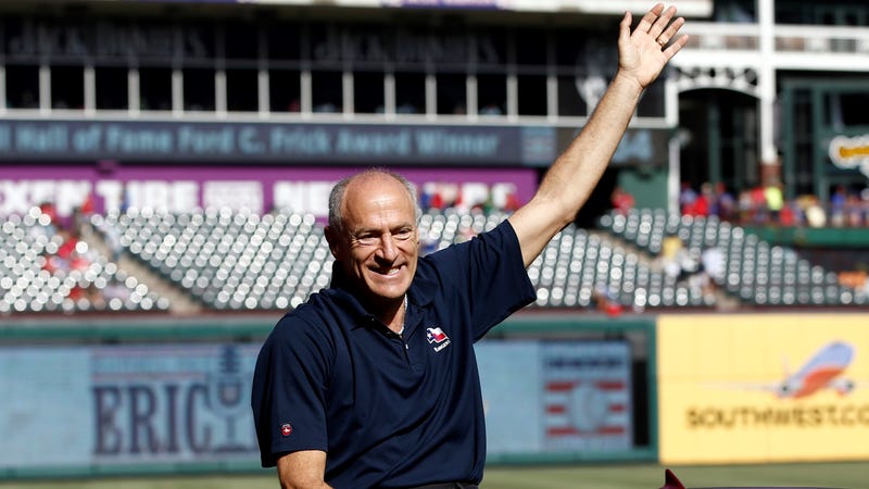 Texas Rangers radio announcer Eric Nadel waves to fans before being presented with the 2014 Ford C. Frick Award prior to a baseball game against the Los Angeles Angels at Globe Life Park in Arlington.