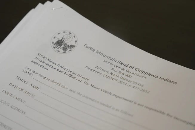 Paperwork to apply for a tribal identification card is displayed Friday, Jan. 23, 2026, in Minneapolis. 