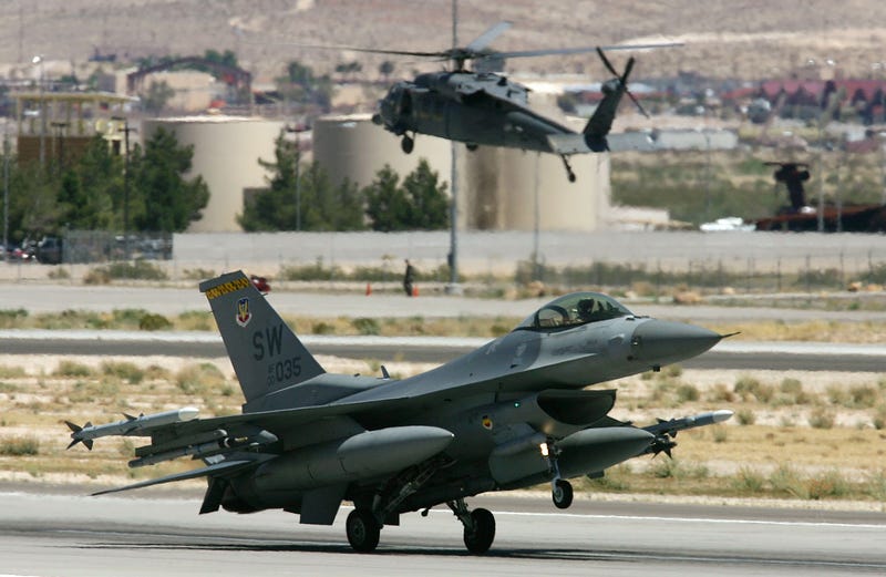 A fighter jet takes off at Nellis Air Force base
