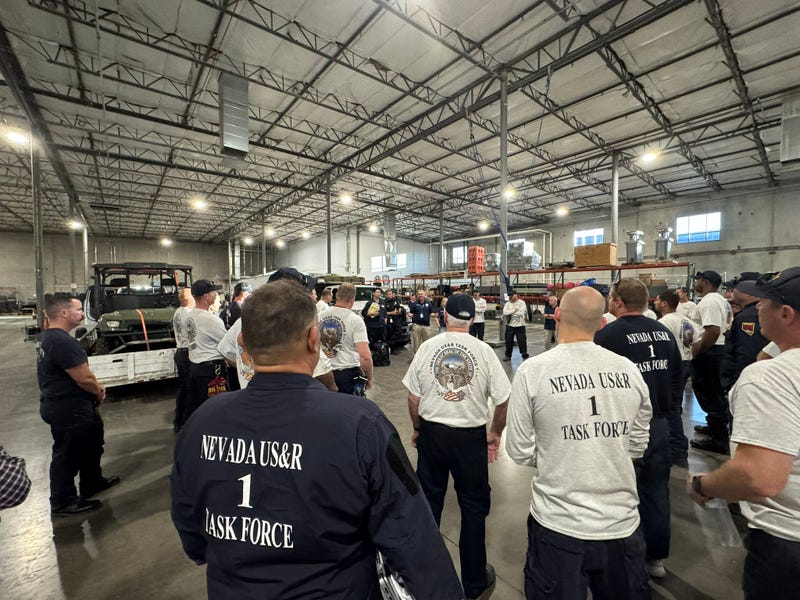Nevada Task Force 1 is briefed before deploying to Texas to assist in flood recovery efforts. 