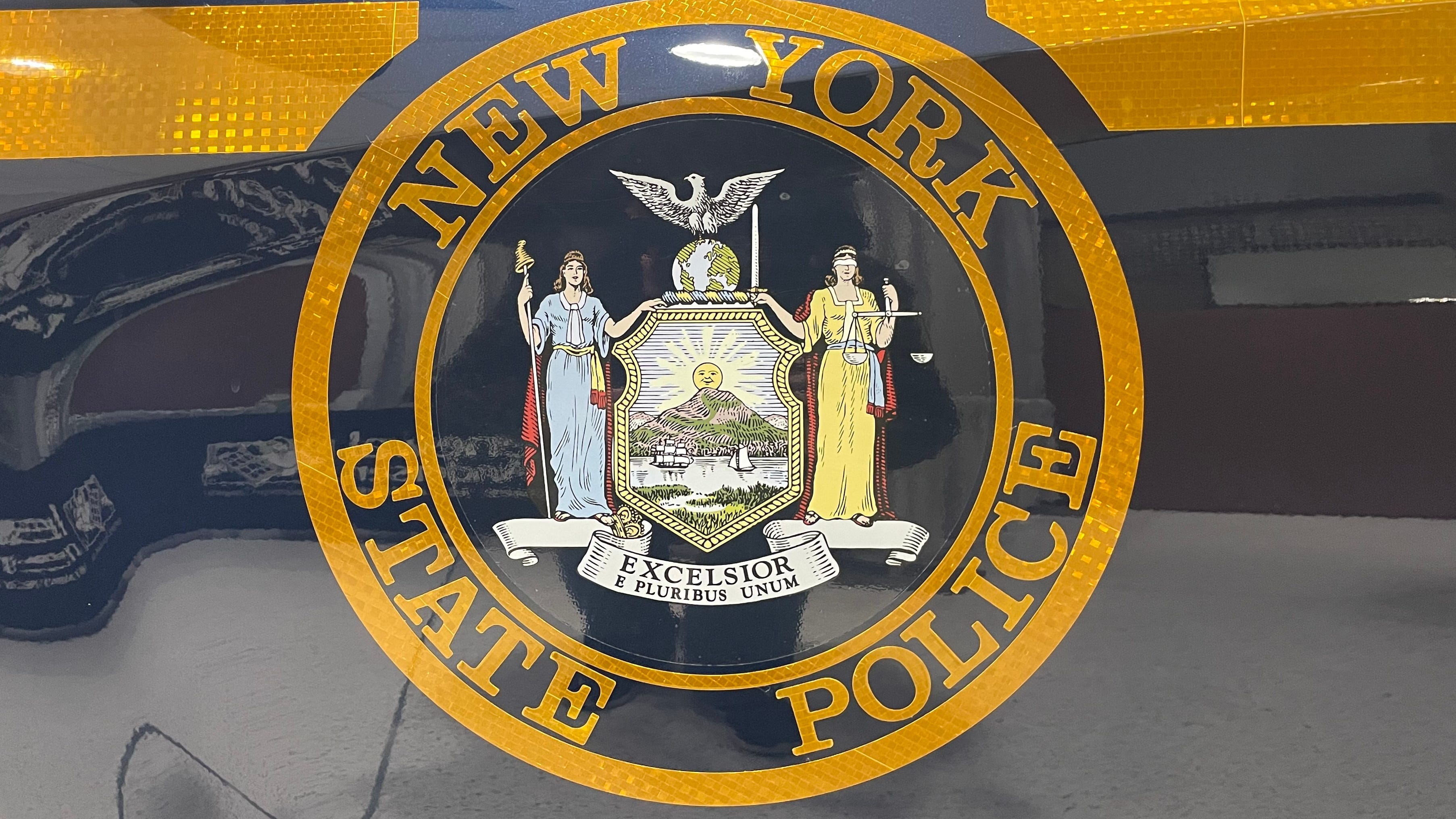 Buffalo woman charged after troopers find 2-year-old in makeshift cage