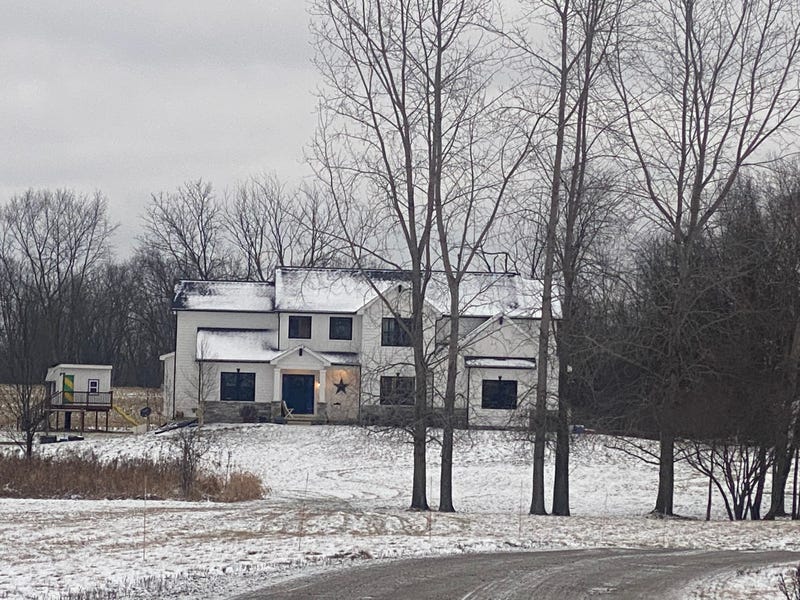 a large, upscale home is the scene of a deadly shooting 