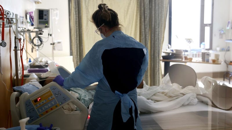  Nurse Elisa Gilbert checks on a patient in the acute care COVID-19 unit at the Harborview Medical Center on January 21, 2022 in Seattle, Washington. 