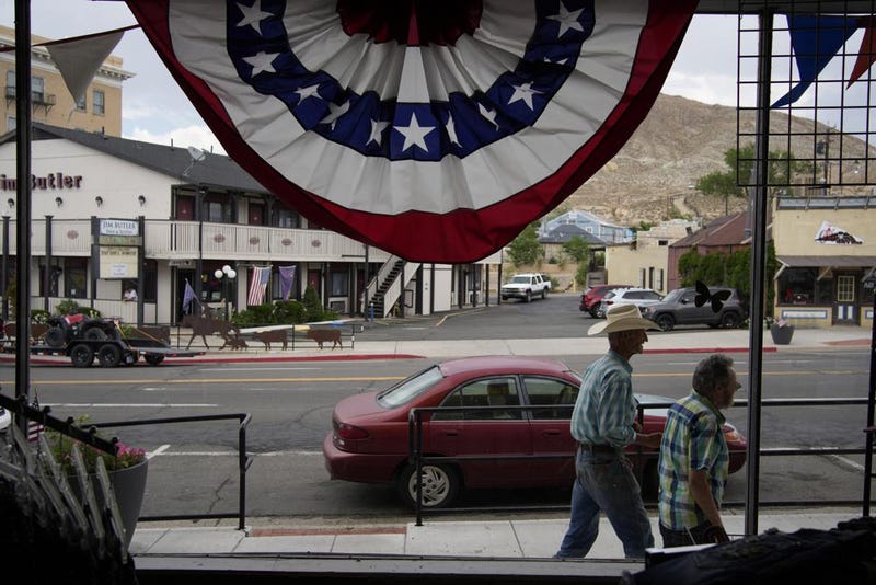 Two men walk down the main street of Tonopah, Nevada