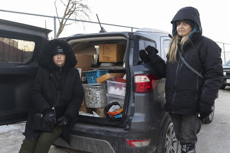 Karen Bigg, director of community outreach at Chicago Recovery Alliance, left, and Erica Ernst, president and volunteer at the Chicago Recovery Alliance, pose for a portrait near West Chicago Avenue & North Albany Avenue in Humboldt Park, Sunday, Jan. 9, 2022.