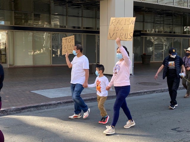Bay Area residents gathered in Oakland to protest the recent violent attacks on Asian Americans.