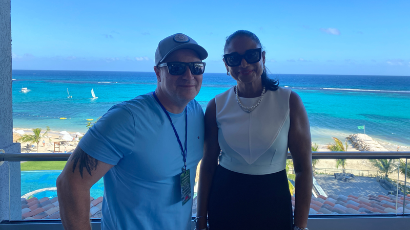 Bill Tafrow talks with Odette Dyer, Regional Director of the Jamaica Tourism Board at Sandals® Dunn's River
