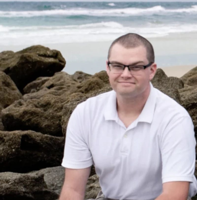 Daytona Beach police Officer Jason Raynor died after being shot in late June, the Daytona Beach Police Department announced. Raynor's family released this photo of him on the beach to the media.