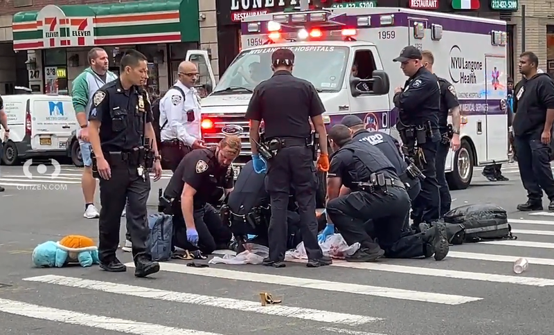 Video shows someone being led to an ambulance by police