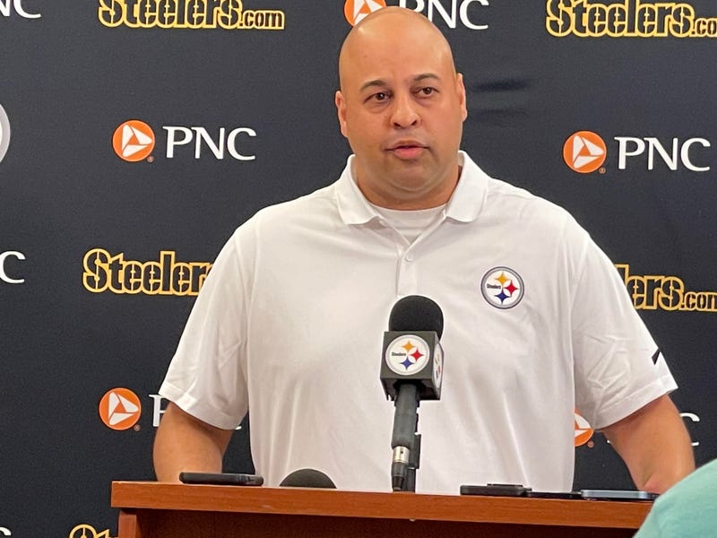 Omar Khan at podium