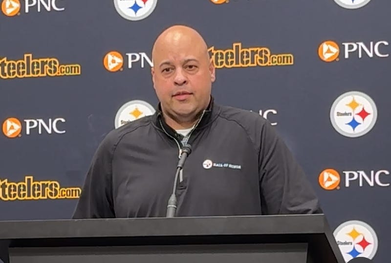 Omar Khan at podium
