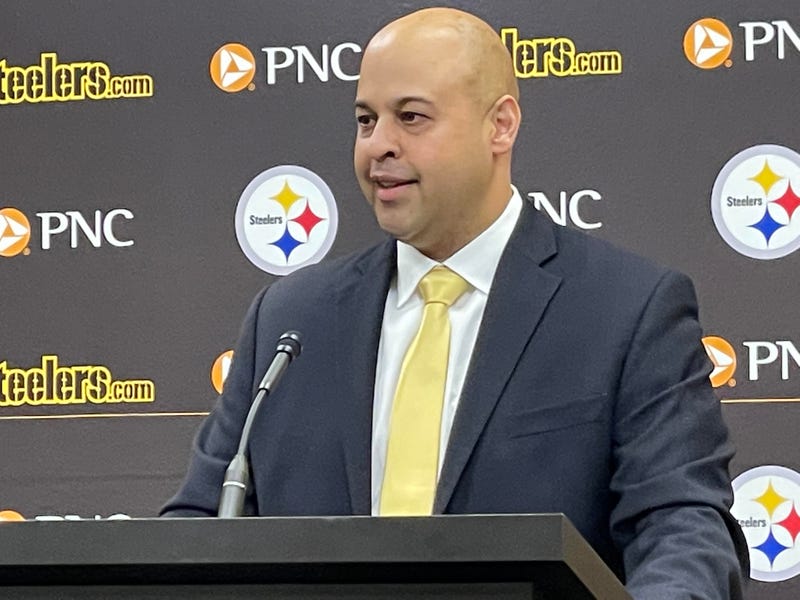 Omar Khan at podium