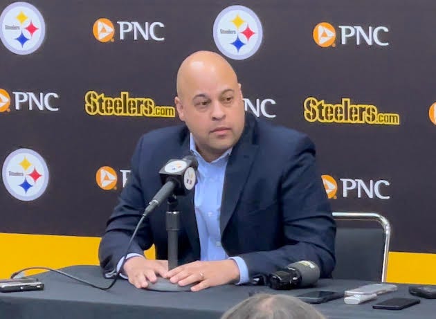 Omar Khan at a podium