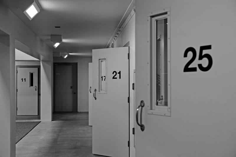 A prison with doors to the cells open
