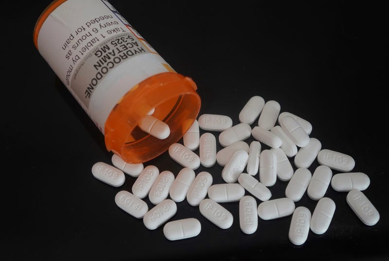 A tipped over bottle of hydrocodone