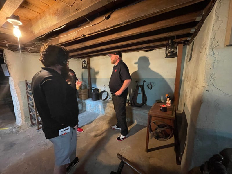 Flyer Paranormal shows WWJ's Zach Clark around the basement of the Orson Starr House