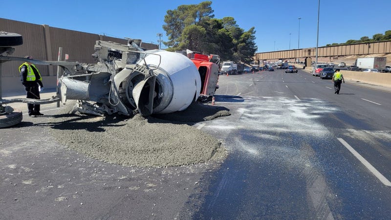 An overturned cement truck ties up traffic on 15 North in North Las Vegas on June 26th, 2023