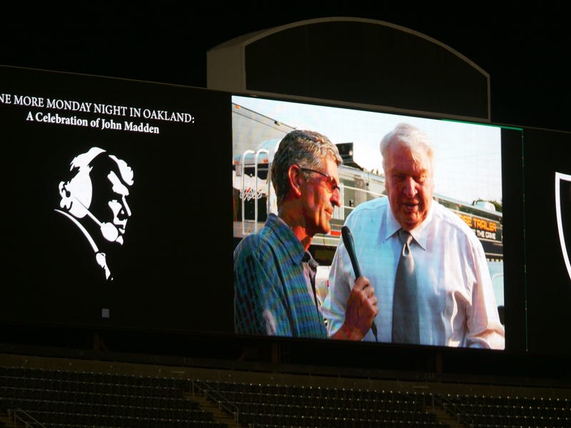 A photo of John Madden and Stan Bunger shown at the memorial.
