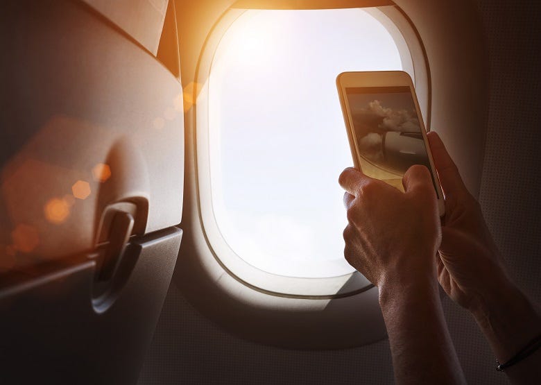 airline passenger with cell phone