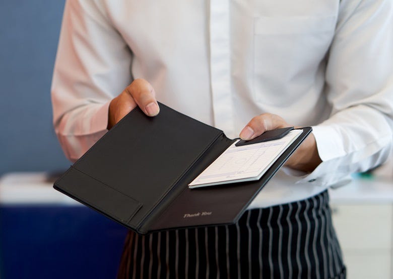 waiter bringing bill