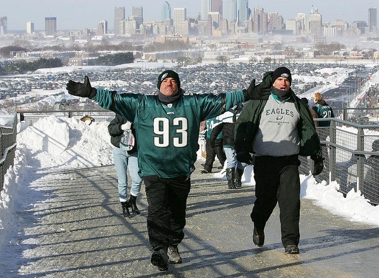 Eagles fans with Philadelphia skyline in distance 