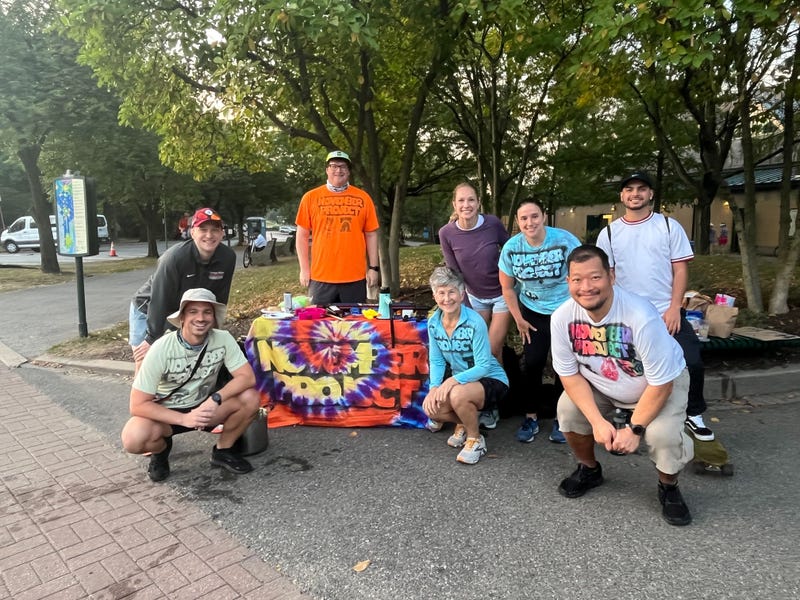 Members of the exercise group November Project pose for a photo at the 2024 Philadelphia Distance Run.