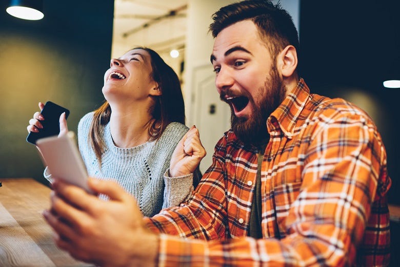 Man getting good news on phone