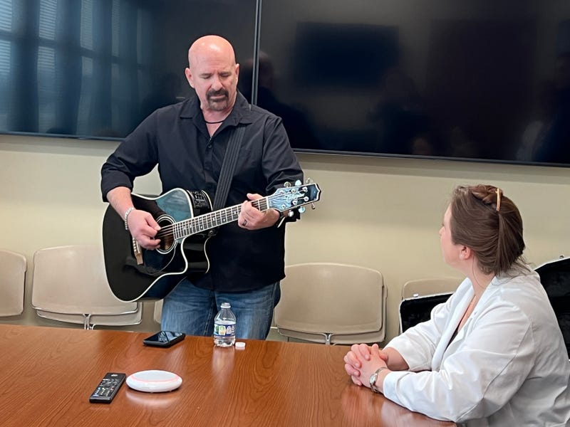 Dave Mikulskis plays his guitar.