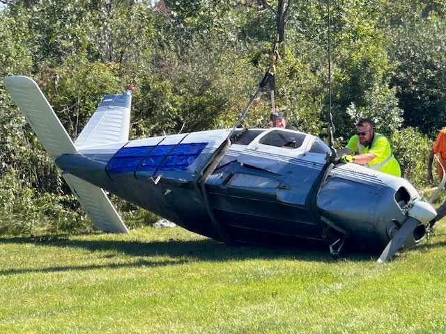 Workers tow plane that crashed