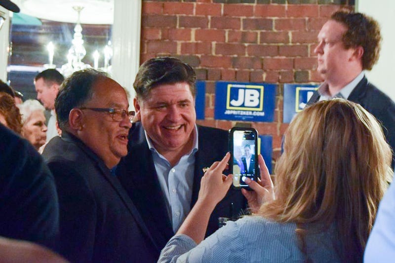 Gov. JB Pritzker takes a picture with Mike Lopez, mayor of nearby Jerome, after announcing his reelection campaign in Springfield on Thursday, June 26.