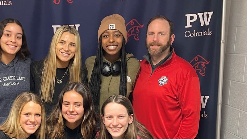 Dan Dougherty, top right, with members of the 2021-22 Plymouth Whitemarsh girls basketball team that won a PIAA state championship.