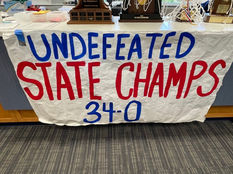 A sign marking the Plymouth Whitemarsh girls basketball state title team's perfect record.