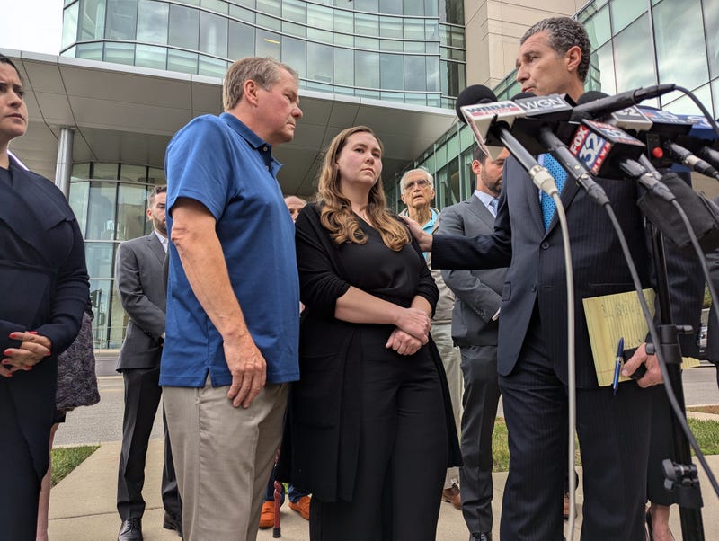 Leah Sundheim, center, waits to speak to the media outside the Lake County Courthouse on Wednesday in Waukegan, where man accused of killing seven people at the 2022 Highland Park Fourth of July Parade rejected his plea deal.