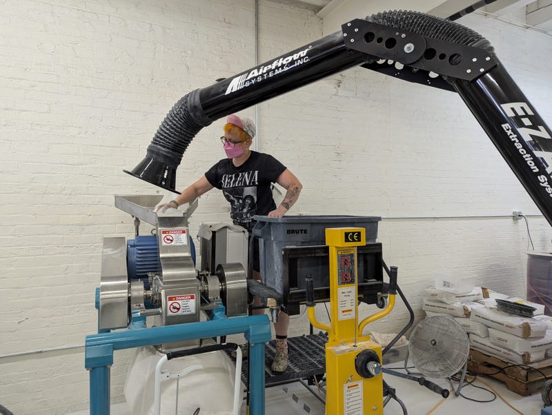 A Meliora Cleaning Products employee operates machinery inside the Chicago-based company's facility in Fulton Market.  