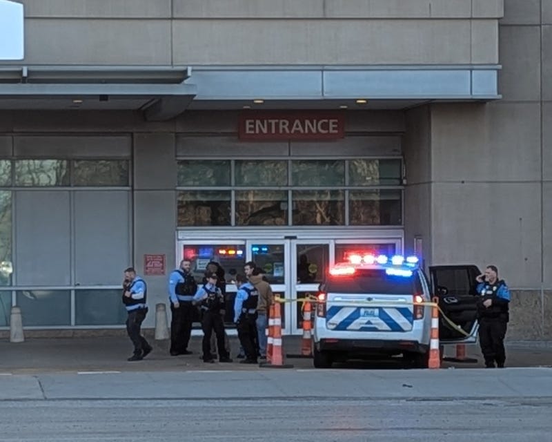 Police tape surrounds an SLMPD Tahoe parked on the curb outside Barnes Jewish Hospital. That carried the injured officer to the ER.