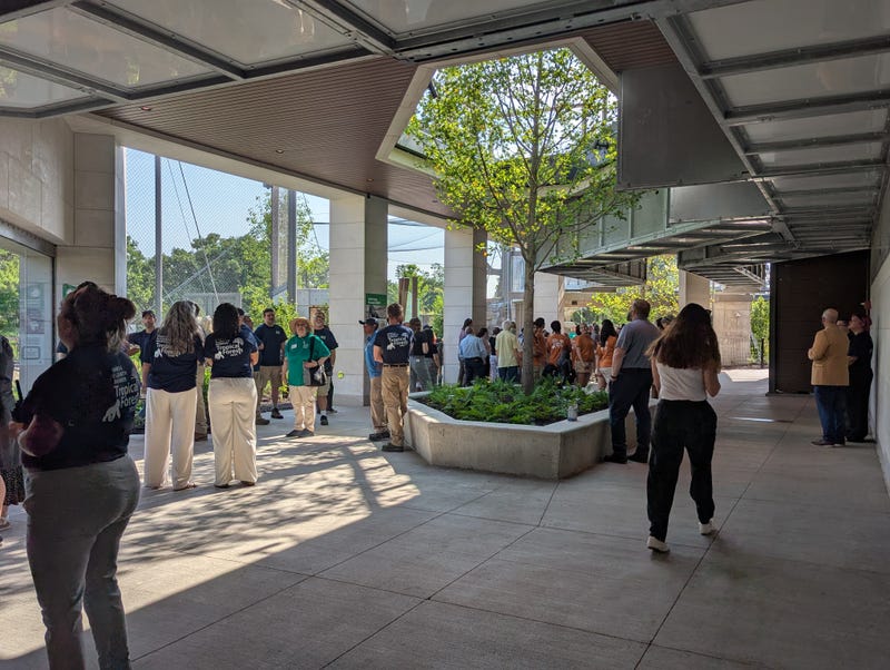 Brookfield Zoo guests walk under primate tunnels between habitats