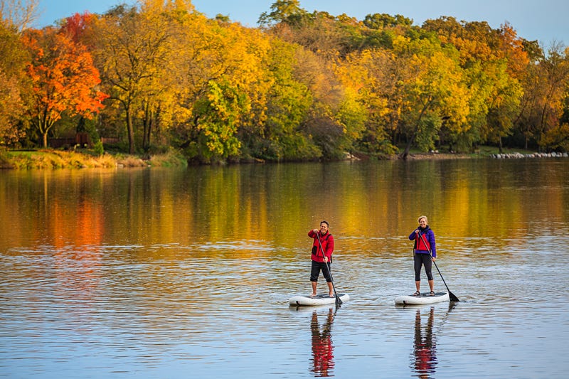 paddling down the river, fall colors