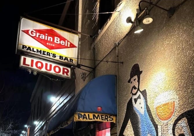 The sign and a visage of a man rarely seen inside Palmer's, one of the Twin Cities' oldest and most famous dive bars.