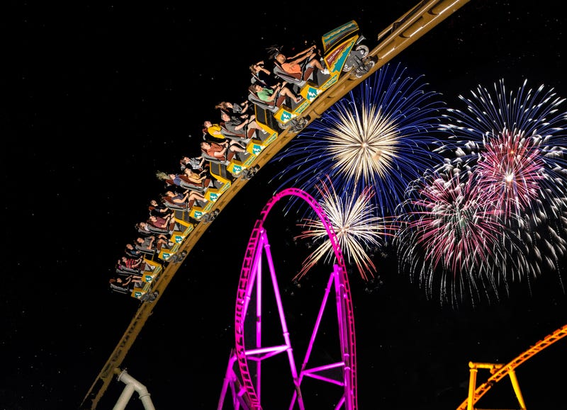 Pantheon roller coaster with fireworks in the background