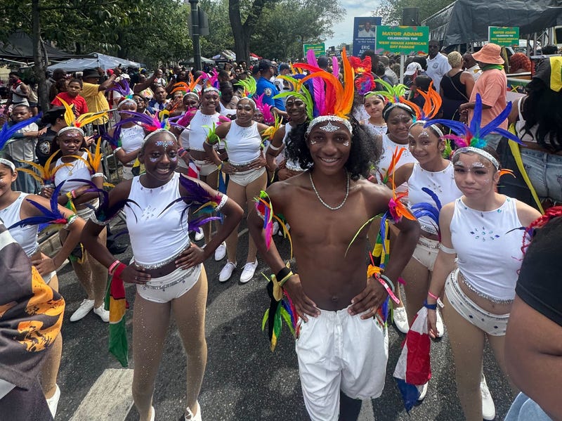 Parade participants pose for a photo at the 2025 West Indian Day Parade on Monday