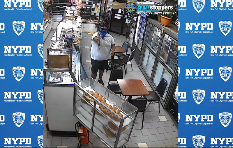 Video shows the suspect pointing the gun during the holdup