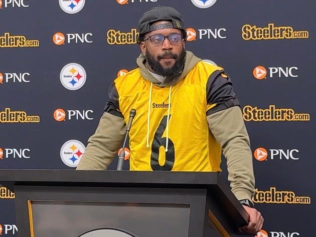 Patrick Queen at podium