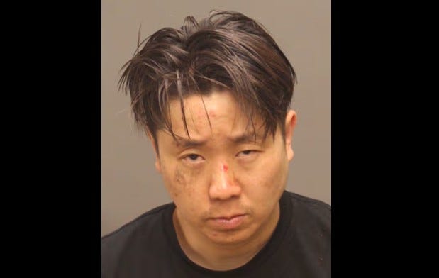 Peter Chan-Woong Chung in a booking photo