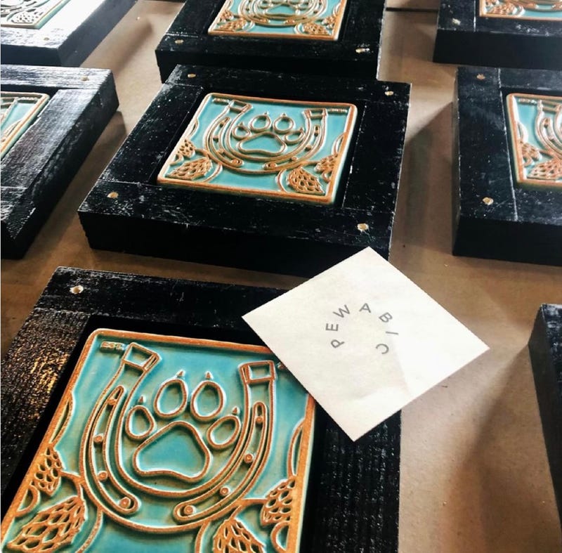 Pewabic tiles at inlaid in the wall at Dog and Pony Show Brewing Co.