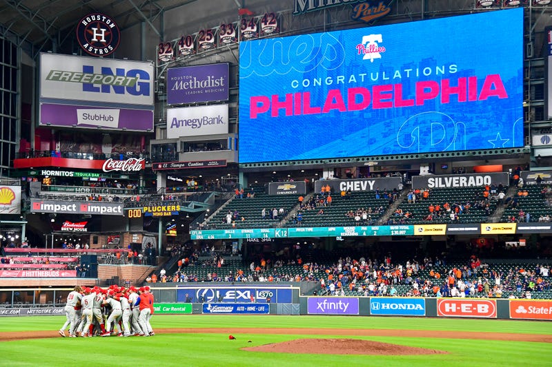 HOUSTON, TEXAS - OCTOBER 03: The Philadelphia Phillies celebrate after clinching the Wild Card, their first playoff berth since 2011 with a 3-0 win over the Houston Astros at Minute Maid Park on October 03, 2022 in Houston, Texas.