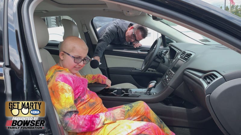 12-year-old Jaycee Amick sits in the car Richard Bazzy just donated to her family.