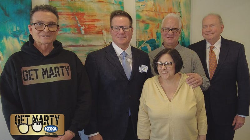 Attorneys Phil DiLucente and Ken Nolan meet with lottery winners Ernie and Mary Bendzsuk.