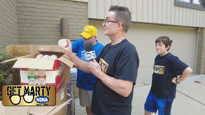 Harry Gerhardt shows Marty and Vincent his collection of balls.